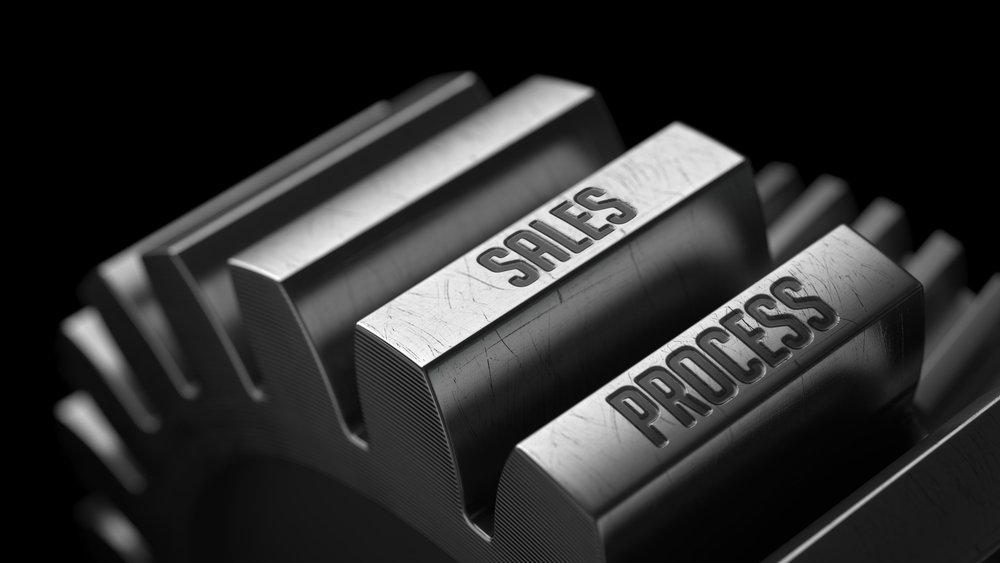 Sales process on the metal gears on black background