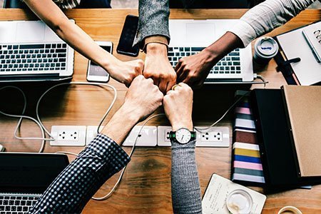 Marketing agency team members fist bump
