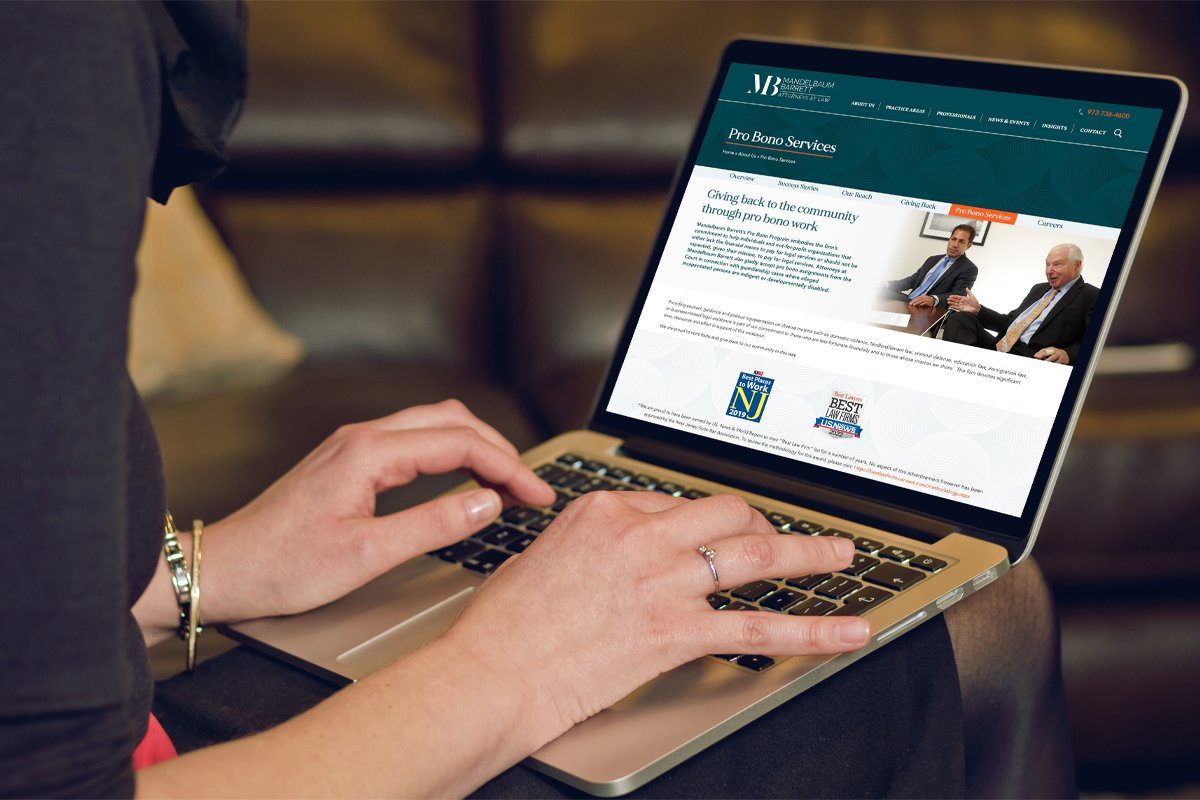 Lap top computer with Mandelbaum Barrett homepage displayed on screen