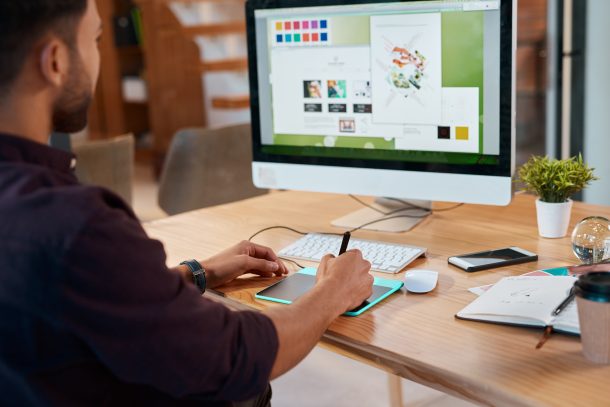 Person on computer creating a graphic design