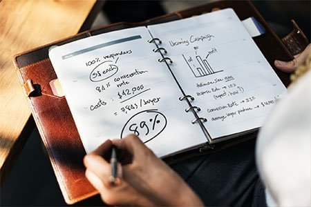 Business woman taking notes on a marketing campaign