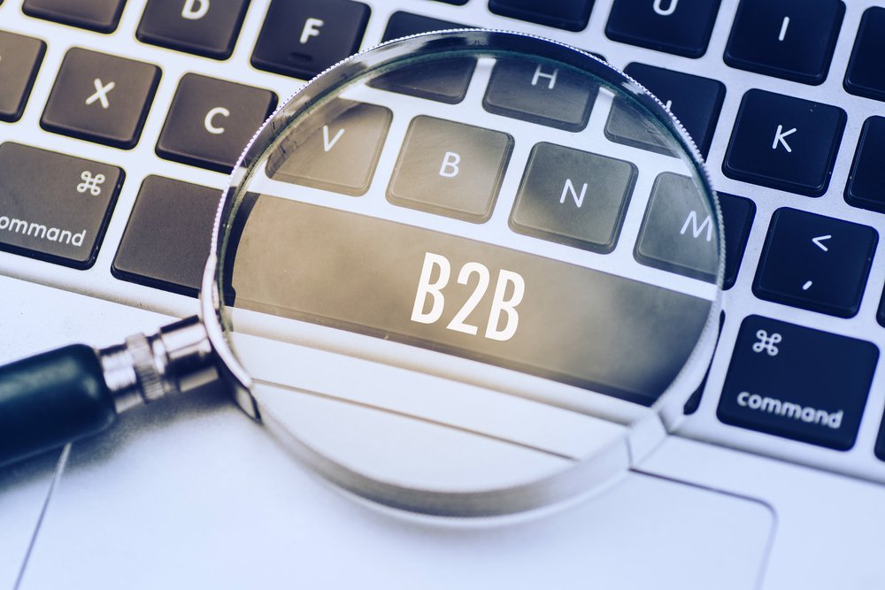 Magnifying glass over B2B letter key on a laptop