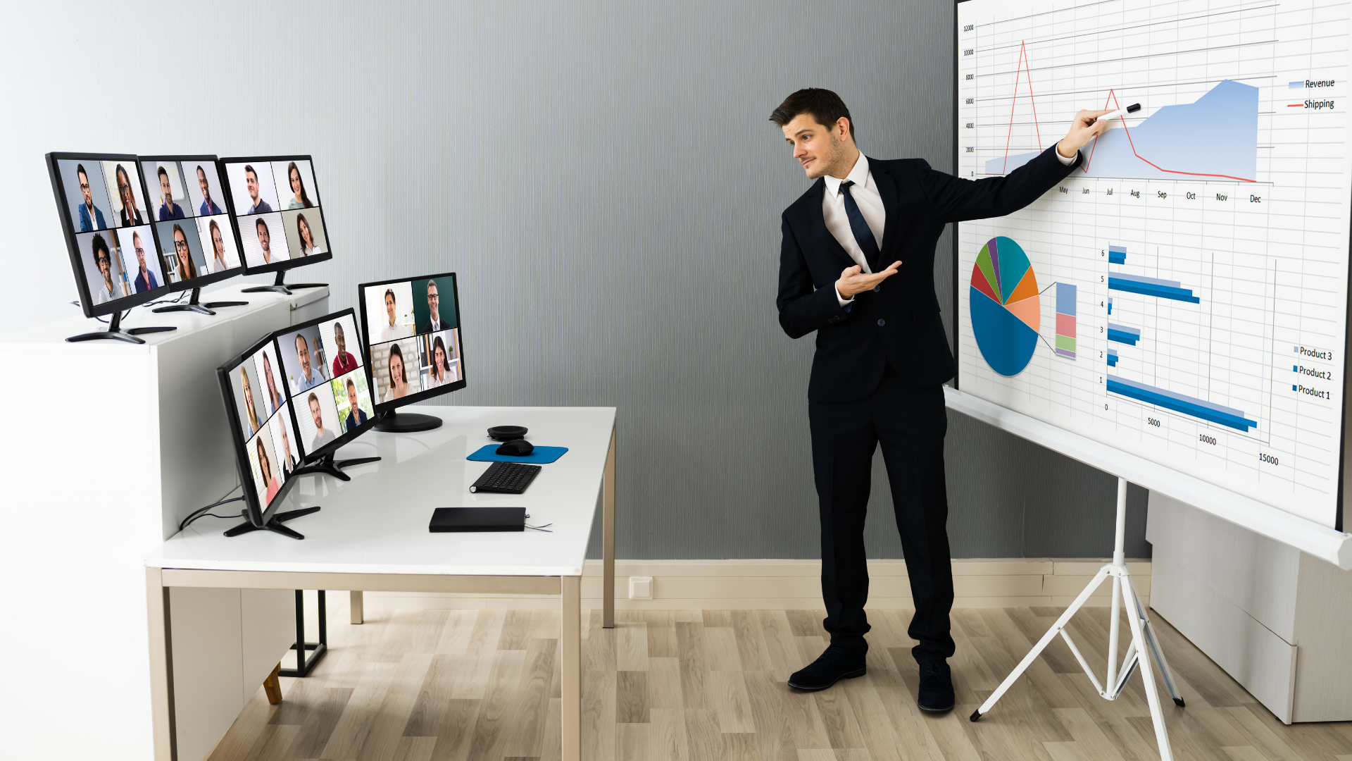 A man standing in front of his computer speaking to people at a virtual event
